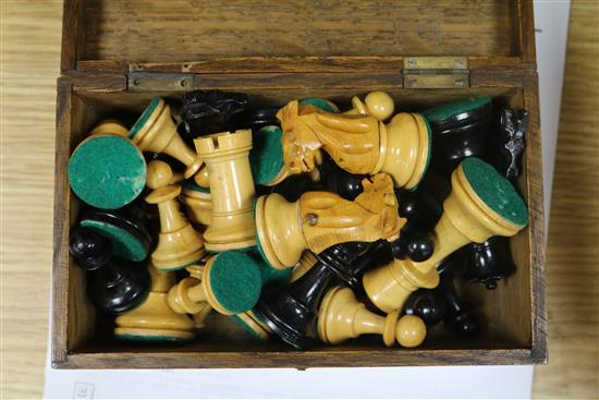 A weighted club-size chess set, two other boxed chess sets and a chess clock